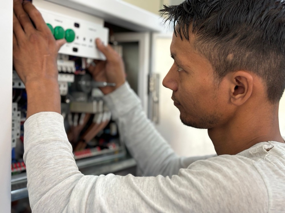 Electrician working on a switchboard